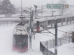 A train leaves the Cyrville Station as LRT deals with a heavy snow day on Thursday.