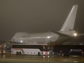 Buses carrying American evacuees from the Diamond Princess cruise ship leave the runway at Joint Base San Antonio-Lackland on February 17, 2020 in San Antonio, Texas. The Diamond Princess cruise ship is docked at the Japanese city of Yokohama and is believed to be the highest concentration of novel coronavirus cases outside of China, where the outbreak began.