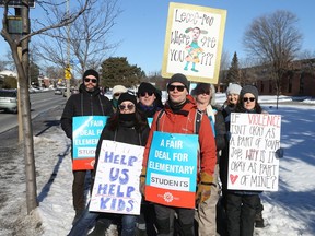 English public elementary teachers, including these picketers at D. Roy Kennedy Public School in Ottawa, struck for two days this week. Now teachers in French-language school boards have announced they plan to begin weekly strikes, starting Feb. 13.