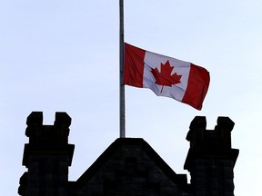 A flag flies at half mast over Queen's Theological Hall on Thursday Jan. 9, 2020 in honour of student Amir Moradi who died in the Ukrainian airline crash near Tehran, Iran.