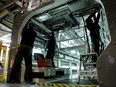 Employees work on a new regional transport train at the Bombardier plant in Crespin, near Valenciennes, northern France, October 17, 2016.