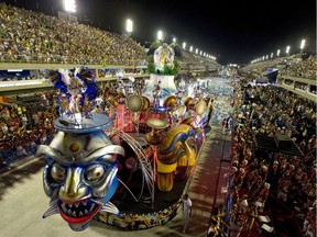 Revelers of the Inocentes de Belford-Roxo samba school perform during the first night of Carnival parade at the Sambadrome in Rio de Janeiro, Brazil on Monday.