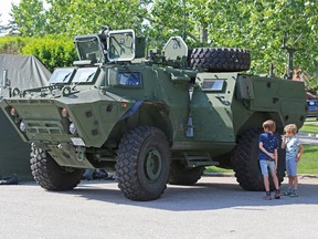Soldiers with the King's Own Calgary Regiment show off one of the military's new $2.5 Million TAPV (Tactical Armoured Patrol Vehicle) vehicles at Spruce Meadows on Thursday June 7, 2018.  Gavin Young/Postmedia
