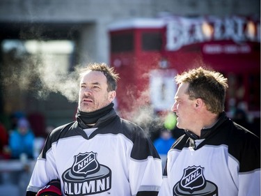 The Ottawa Senators Alumni and NHL Alumni held a shinny game at the Rink of Dreams in front of City Hall Saturday, February 8, 2020, part of the Home Town Hockey Tour. L-R Shawn Rivers chats with NHL Alumni teammate Bryan Richardson.