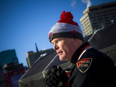 The Ottawa Senators Alumni and NHL Alumni held a shinny game at the Rink of Dreams in front of City Hall Saturday, February 8, 2020, part of the Home Town Hockey Tour. Jim Kyte let the warm sun hit him before the game started Saturday.   Ashley Fraser/Postmedia