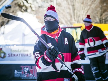 The Ottawa Senators Alumni and NHL Alumni held a shinny game at the Rink of Dreams in front of City Hall Saturday, February 8, 2020, part of the Home Town Hockey Tour. Ottawa Senators Chris Neil flips a puck on his stick before the game started.