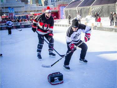 The Ottawa Senators Alumni and NHL Alumni held a shinny game at the Rink of Dreams in front of City Hall Saturday, February 8, 2020, part of the Home Town Hockey Tour. NHL Alumni Bryan Richardson scores in the very tiny net.   Ashley Fraser/Postmedia