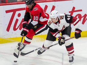 Ottawa Senator Drake Anthony Duclair battles for the puck with Arizona Coyotes Ilya Lyubushkin during NHL action at the Canadian Tire Centre on Wednesday.