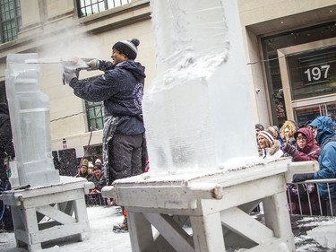 An ice carver at work during the Winterlude competition on Sparks Street Mall on Saturday.