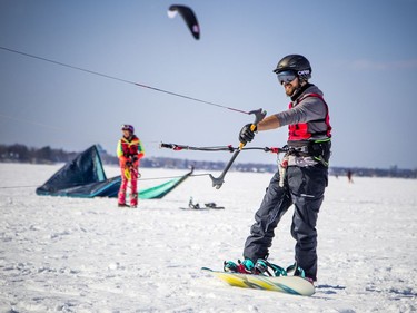 Cirrus Pruchnicki gets ready to launch his kite and take off on his snowboard Saturday.
