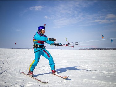 Brent Schmidt gets his telemark skis on and gets ready to launch his kite prior to the race start.
