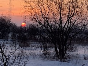 The sun rises off West Hunt Club in Ottawa on Sunday Feb. 23, 2020. Elizabeth Mavor / Postmedia