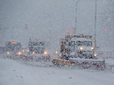 Snowploughs on Carling Avenue during a heavy snowfall in Ottawa. February 27, 2020. Errol McGihon/Postmedia