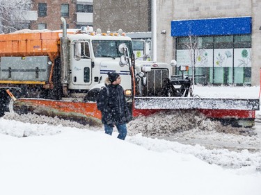 Snowploughs on Carling Avenue during a heavy snowfall in Ottawa. February 27, 2020.