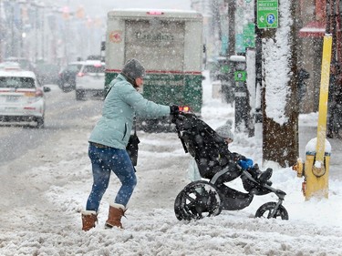 Moms with strollers had a hard time getting through the heavy slush around the Glebe Thursday.