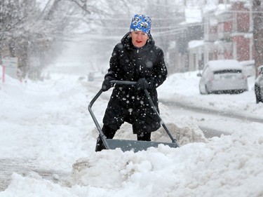 Mary Chaput really had to put her back into it to clear the snow from the front of her house in the Glebe