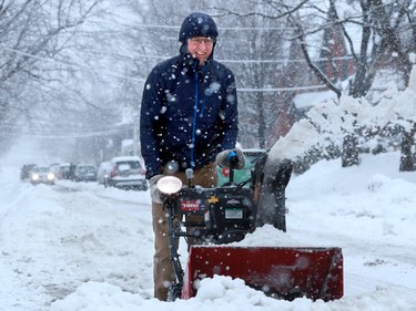 Good neighbour Peter McIlroy dug out his neighbours around him on Fourth Avenue in the Glebe Thursday morning.