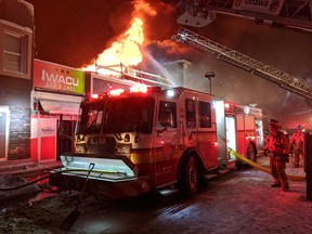 Ottawa firefighters battle a three-alarm blaze in a retail building on the north side of Montreal Road between North River Road and Vanier Parkway, Feb. 27, 2020. Scott Stillborn/Ottawa Fire Services.