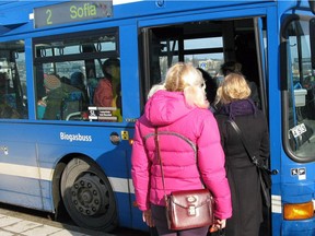 File photo of people boarding a bus in Stockholm, Sweden.