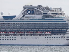 The upper decks of the Diamond Princess cruise ship with over 3,000 people look empty as the ship sits anchored in quarantine off the port of Yokohama on February 4, 2020, a day after it arrived with passengers feeling ill. - Japan has quarantined the cruise ship carrying 3,711 people and was testing those onboard for the new coronavirus on February 4 after a passenger who departed in Hong Kong tested positive for the virus.