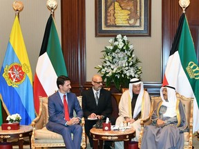 A photo provided by the Kuwaiti news agency KUNA on February 11, 2020, shows Kuwait's Emir Sheikh Sabah al-Ahmad al-Sabah (R) receiving Canadian Prime Minister Justin Trudeau at Bayan palace in Kuwait City.