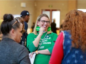 Kelsie Nisperos, centre, participates in the Nevada Democratic Caucuses at Desert Oasis High School on Feb. 22, 2020, in Las Vegas.  There are 2,099 Nevada precinct caucuses with voting held at 252 sites throughout the state. (Photo by Ronda Churchill / AFP)