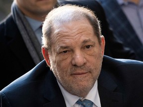 (FILES) In this file photo taken on February 24, 2020 Harvey Weinstein arrives at the Manhattan Criminal Court, in New York City.
