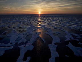 The midnight sun shines across sea ice along the Northwest Passage in the Canadian Arctic Archipelago.