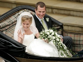 FILE PHOTO: Britain's Peter Phillips (R) and Canada's Autumn Kelly leave St George's Chapel after their marriage in Windsor, southern England on May 17, 2008.