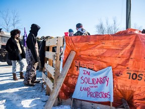 First Nations members of the Tyendinaga Mohawk Territory near Belleville block train tracks servicing Via Rail, as part of a protest against British Columbia's Coastal GasLink pipeline.