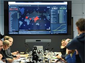 A display shows the latest information on the spread of the novel coronavirus worldwide during a crisis meeting of government  officials in Berlin, Germany, February 28, 2020.