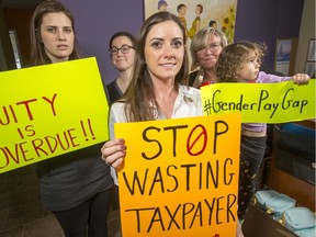 Christi Baker (C) with her fellow midwives (from left) Nicole Pichette, Libby Ormond and Sharon Dean holding Clara Godin, 4, will be protesting local MPP's in their fight for pay equity.