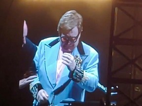 This videograb taken from a concert video obtained from the Twitter account of Tim McCready shows Elton John tearfully apologizes to fans after cutting short a concert in Auckland due to illness, with the British superstar saying he was suffering from "walking pneumonia" on February 17, 2020.