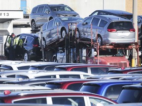 A worker loads Chrysler Pacifica models at the Windsor Assembly Plant in Windsor on Wednesday, February 19, 2020.