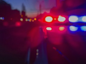 Red and blue Lights of police car in night time.