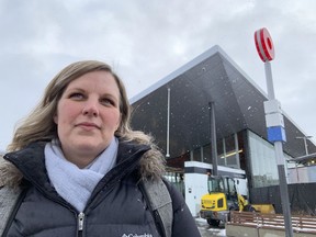 Sarah Wright-Gilbert, a citizen transit commissioner, outside the Tunney's Pasture Station.