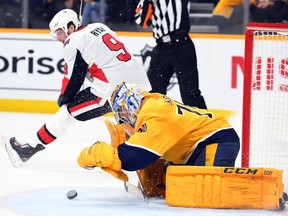 Predators goaltender Juuse Saros covers the puck after a shot by another Senators player gets past winger Bobby Ryan, playing his first game since mid-November.