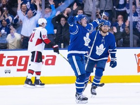 Mitch Marner celebrates scoring the winning goal during the overtime period against the Ottawa Senators at the Scotiabank Arena.