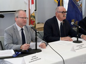 Collins Bay Institution warden Larry Ringler, left, and Ontario Provincial Police Det. Insp Jim Gorry speak a news conference at the institution on Friday regarding the arrests of three men — two drone operators and an inmate — allegedly involved in bringing contraband into the institution. (Ian MacAlpine/The Whig-Standard)