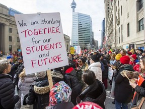 Ontario teachers and education workers picket in Toronto on Feb. 12.
