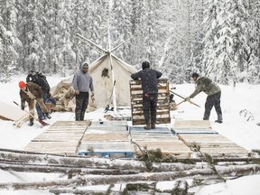 Supporters of the Wet'suwet'en hereditary chiefs and who oppose the Costal Gaslink pipeline work on a support camp just outside of Gidimt'en checkpoint near Houston B.C., last month.