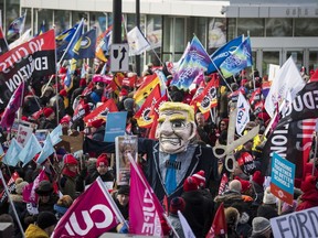 Members of the Ontario Federation of Labour protest outside the Scotiabank Convention Centre during the Ontario Progressive Conservative party 2020 policy convention in Niagara Falls, Ont. on Saturday, February 22, 2020.