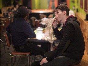 A customer vapes cannabis at the Hotbox Cafe in Toronto on Saturday, January 20, 2018. Ontario is considering allowing licensed cannabis consumption lounges in the province once recreational marijuana is legalized this summer, and is asking the public to weigh in on the idea.