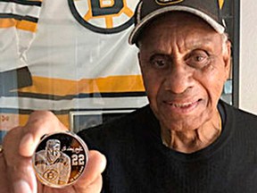 Willie O'Ree holds a new silver coin from the Royal Canadian Mint depicting himself, the first African-Canadian to play the National Hockey League. The coin was released on Tuesday. O'Ree played one season, 1959-60, for the Eastern Professional Hockey League's Kingston Frontenacs.