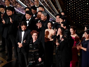 Miky Lee, Kwak Sin Ae and Bong Joon Ho react after winning the Oscar for Best Picture for "Parasite" at the 92nd Academy Awards in Hollywood, Los Angeles, California, U.S., February 9, 2020.