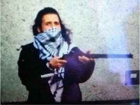 Michael Zehaf-Bibeau during his attack on the National War Memorial and Parliament Hill in 2014.