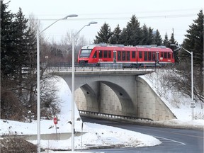 The O-Train makes its way through Ottawa.