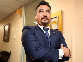 Ottawa police Const. Khoa Hoang, who alleged he was the victim of a racist campaign to block him from promotion, has reached a settlement in his human rights case against the force.