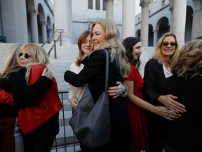 The Silence Breakers, a group of women who spoke out about Harvey Weinstein's sexual misconduct hug after a news conference outside Los Angeles City Hall a day after the Harvey Weinstein verdict in Los Angeles, U.S., February 25, 2020.