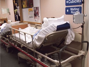 File photo/ Patients wait in the hallway at the overcrowded Queensway-Carleton Hospital.